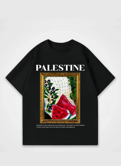 Palestine T-shirt featuring framed artwork with watermelon, olives, and keffiyeh pattern – symbolic streetwear design by Peacemaker promoting peace and freedom